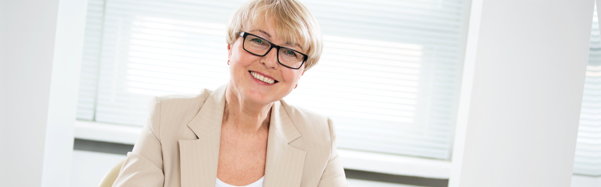 woman dressed formal smiling